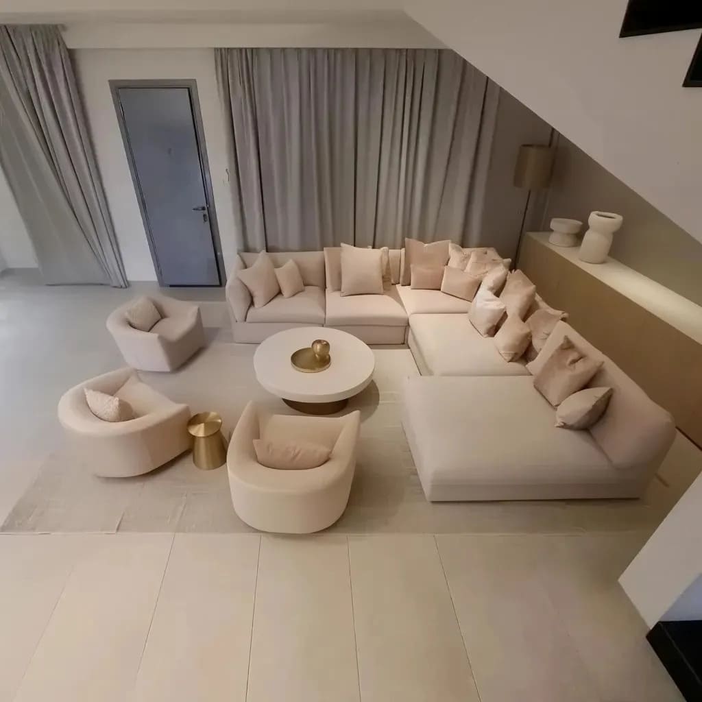 A lounge is characterized by its monochromatic palette and minimalist approach, delivering an understated elegance