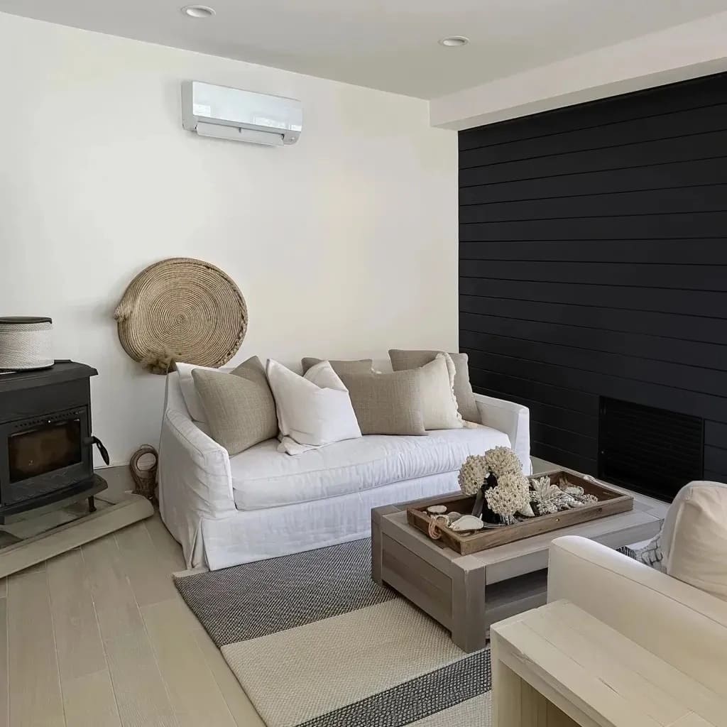 the space is a black shiplap accent wall, contrasting beautifully with the white walls and adding architectural interest