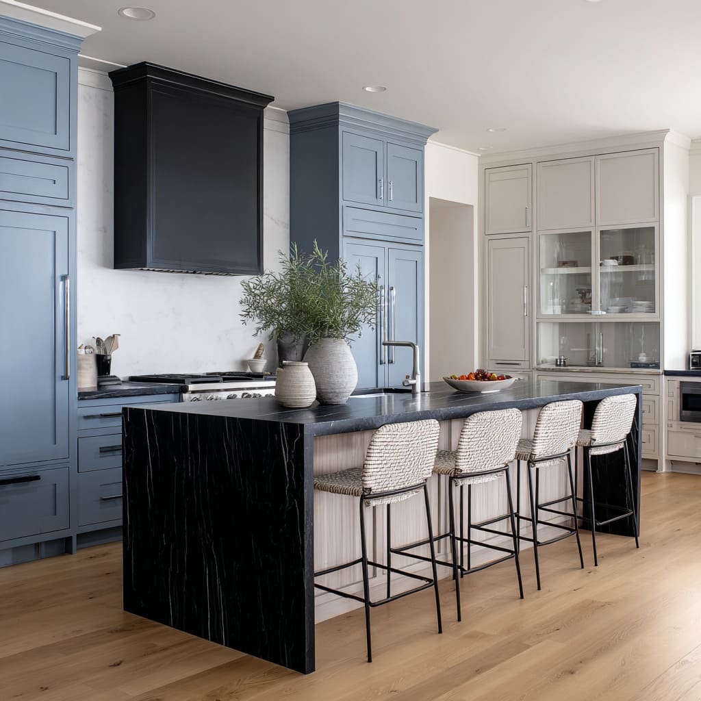 Off-white rope-woven stool ideas with slim black frames arranged at a bold black waterfall island and blue millwork Off-white rope-woven stool ideas with slim black frames arranged at a bold black waterfall island and blue millwork